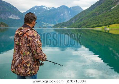 Stryn, Norway - 26.06.2018: Fisherman On Oppstrynsvatn Is A Lake In The Municipality Of Stryn In Sog