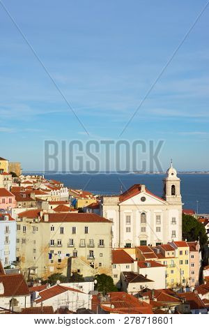 Alfama downtown and Santo Estevao Church in Lisbon, Portugal.