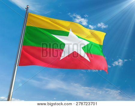 Myanmar - Burma National Flag Waving On Pole Against Sunny Blue Sky Background. High Definition