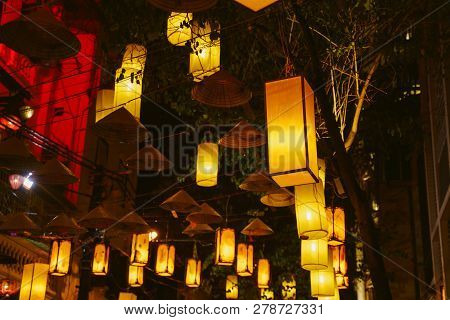 Hanoi City Old Town. Vietnam At Night. Asian Conical Hats And Lanterns Background
