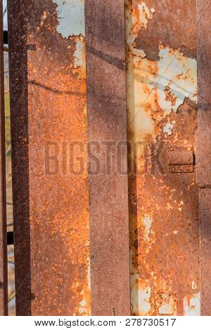 Side View Of Old Electrical Switch Box Inside Rusty Metal Utility Box Security Cage.