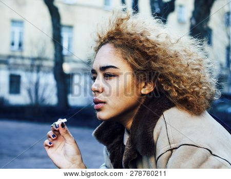 Young Pretty Girl Teenage Outside Smoking Cigarette, Looking Lik