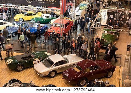 Essen, Germany - Mar 23, 2018: Visitors Viewing The Classic Cars Showcased At The Techno Classica Es