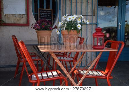 Decoration Of Table With Plant And Candle Lantern