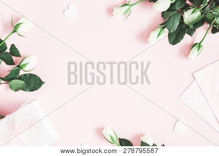 Valentine's Day Composition. Gift Box, White Rose Flowers, Envelope On Pastel Pink Background. Valen