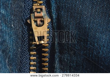 Macro Of Yellow Zipper On Blue Jeans Trousers, Selective Focus Zipper. Royalty High-quality Free Sto