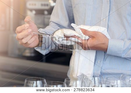 Hands Of Bartender Wipes The Wine Glasses. The Waiter Wipes The Wine Glasses. The Bartender Cleans T