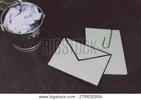Envelope With Clip Symbol Of Email And Attachments With Trash Can Next To It