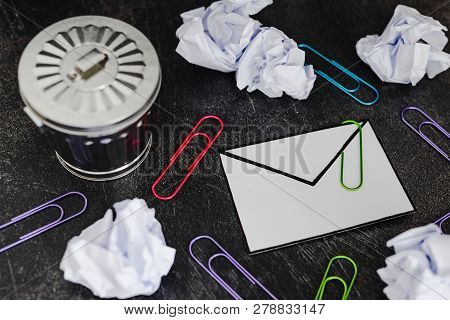 Envelope With Clip Symbol Of Email And Attachments With Trash Can Next To It
