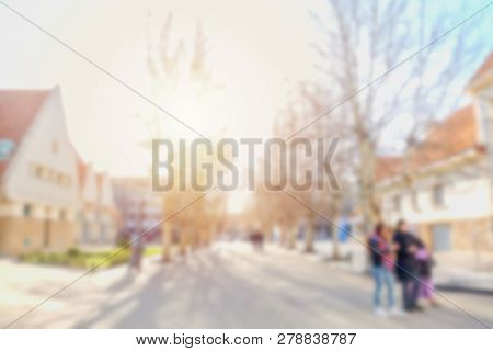 Blurred Image Of People Walking Along The Street In A Village. Ifrane, Morocco.