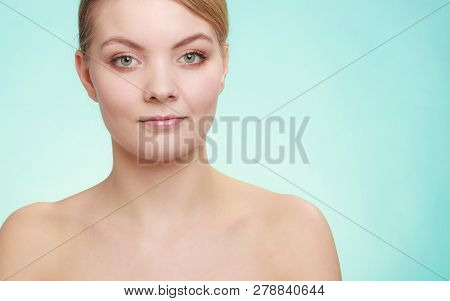 Beautiful Woman With Bare Shoulders. Attractive Girl With Perfect Clean Skin.   Studio Shon On Blue 