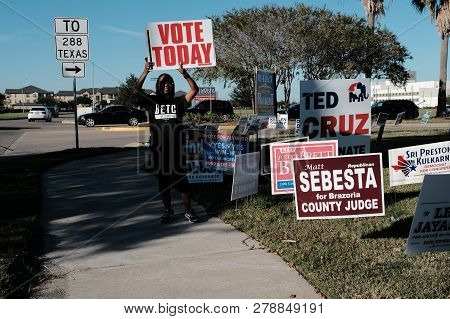 City Of Pearland, Texas - November 2, 2018: A Volunteer Holding Vote Today Sign Outside Voting Stati