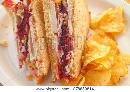 Sandwich Made From Thanksgiving Leftover Turkey, Cranberry Sauce And Stuffing With Stuffing-flavored