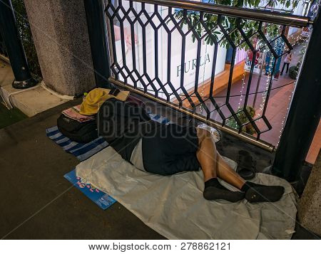 Bangkok/thailand - 13 December 2018:unacquainted Homeless Sleeping On The Foot Overpass At Bangkok C