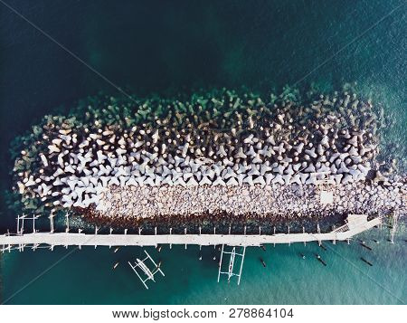 Concrete Breakwaters. Seascape With Concrete Tetrapodes To Protect Coastal Structures From Destructi