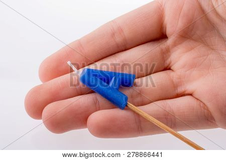 Color Candle In Hand On Sticks Writes The Lettera