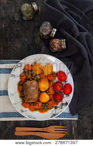 Beef meat stewed with potatoes-Traditional French cuisine Beef Bourguignon potatoes carrots in persillade