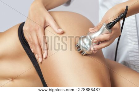 The Doctor Does The Rf Lifting Procedure On The Legs And Hips Of A Woman In A Beauty Parlor. Treatme