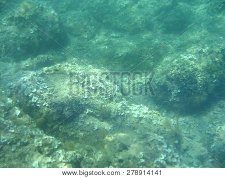 Aquamarine Adriatic Seabed With Daylight Coming Through The Depth Of The Sea.
