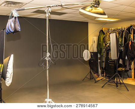 Professional Photography Studio With Lighting And Backdrop