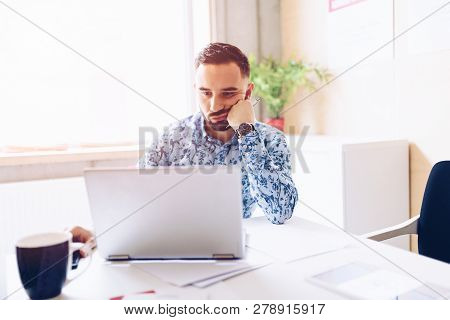 Caucasian Thoughtful Businessman In His Office.