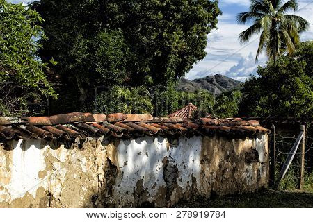 Rustic Clay Wall- Surface Of The Cracked Wall Of The Old Bahareque House