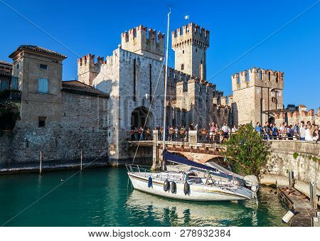 Sirmione, Italy - September 29, 2018: View Of The Medieval Rocca Scaligera Castle In Sirmione Town O