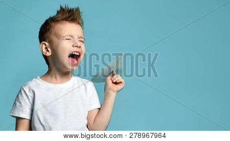 Young Baby Boy Kid In White T-shirt Hold Paper Plane Origami Shouting Screaming On Blue Green Mint B