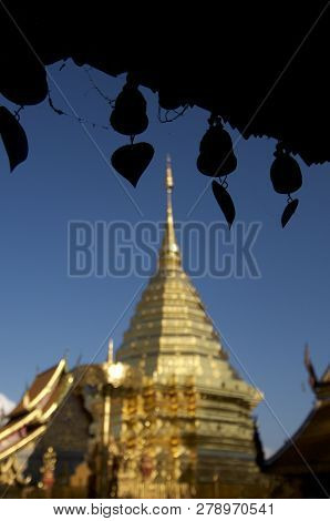 Close Up Picture Of Some Wind Chimes Hanging In Front Of The Chedi Of The Wat Phra Doi Suthep Temple