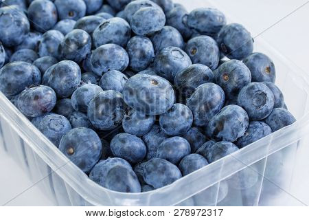 Close Up Of Blueberries In A Container On White Background