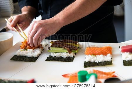 Chef Making Sushi In The Bar Close Up