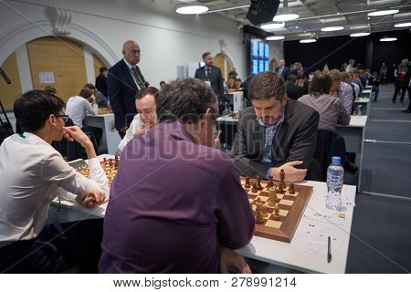 ST. PETERSBURG, RUSSIA - DECEMBER 27, 2018: Men compete in King Salman World Rapid Chess Championship 2018. In front Peter Svidler, Russia (right) vs Boris Gelfand, Israel