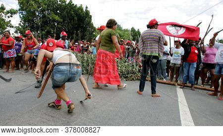 Eunapolis, Bahia / Brazil - March 1, 2011: Women From The Landless Movement Block Br 101 Highway In 