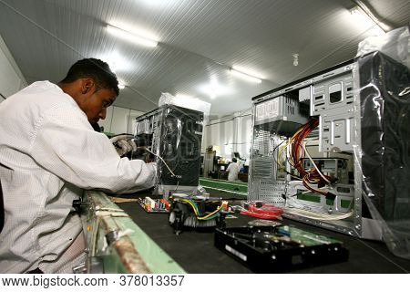 Ilheus, Bahia / Brazil - June 13, 2011: Employee Is Seen During Computer Assembly In Factory At Comp