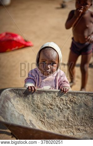 african child in a village in Botswana