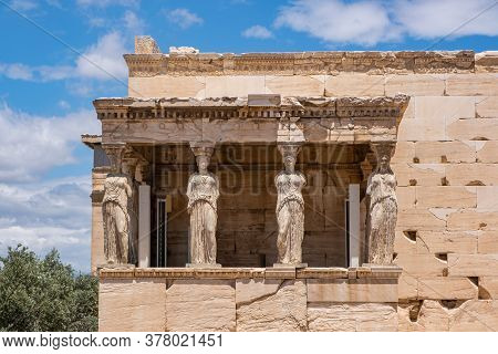 Athens, Greece. Cariatides Porch Erechtheion On Acropolis Hill, Blue Sky Background