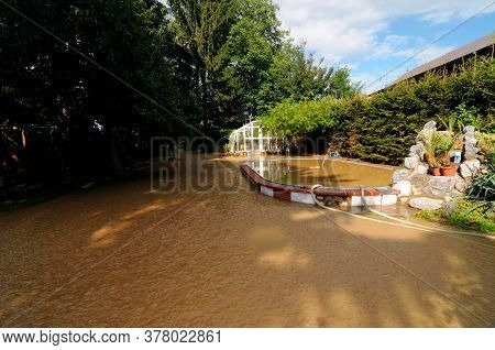Building In A Flooded Area After Heavy Rainfalls, Muddy Water