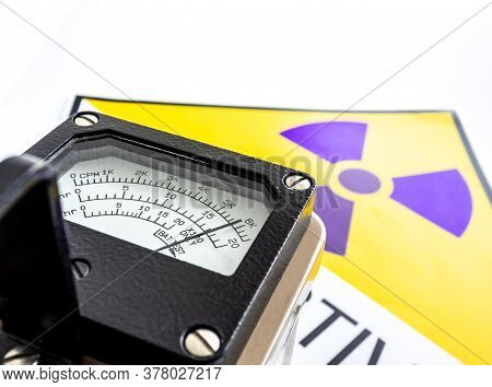 Hand-held Radiation Survey Instrument Detecting At The Radioactive Material Symbol On Label