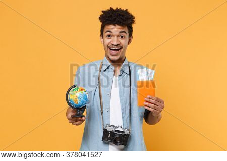 Excited Young African American Guy In Blue Shirt With Photo Camera Traveling Abroad Isolated On Yell