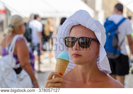 View Of Tourist Eating Icecream On The Streets Of Old Town