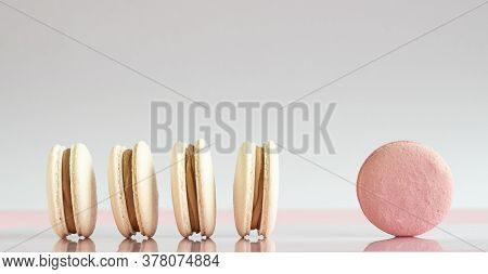 White And Pink Macarons On A White, Pink Background.