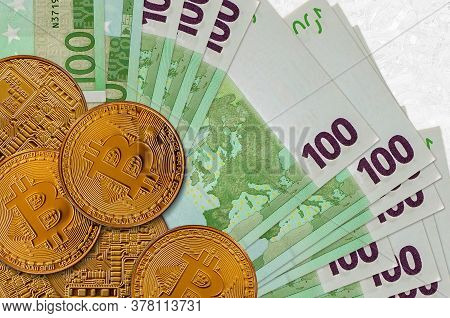 100 Euro Bills And Golden Bitcoins. Cryptocurrency Investment Concept. Crypto Mining Or Trading