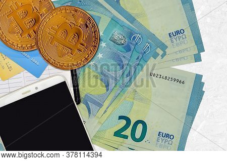 20 Euro Bills And Golden Bitcoins With Smartphone And Credit Cards. Cryptocurrency Investment Concep