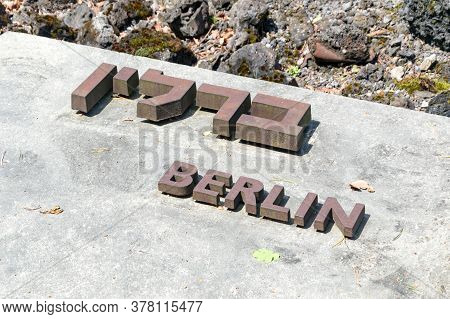 Belzec, Poland - June 12, 2020: Berlin City Name In Yiddish And Polish Language At Belzec Exterminat