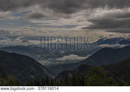 View On Drau River Valley From Path To Mittagskogel Hill In Cloudy Summer Day