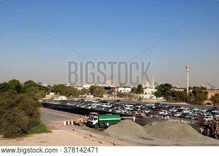 Country-u.a.e City- Dubai, Date 07/22/2020 Car's Park In Open Parking Lot In Dubai With Background O