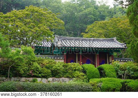 Landscape View Of Green Bush Near Small House