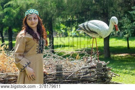 Armenian Young Woman In Traditional Clothes In The Forest