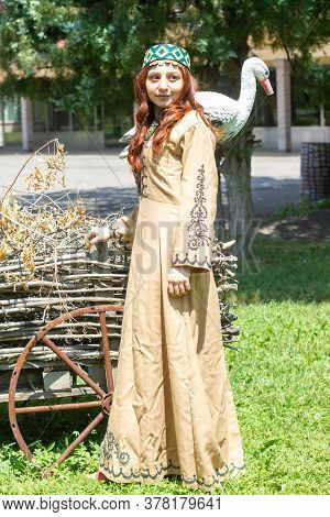 Armenian Young Woman In Traditional Clothes In The Forest