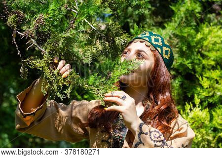 Armenian Young Woman In Traditional Clothes In The Forest